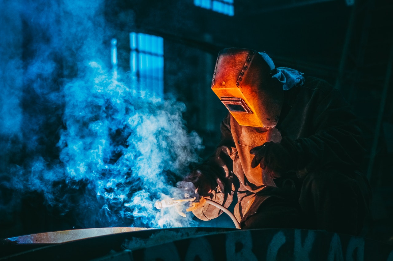 Worker welding steel